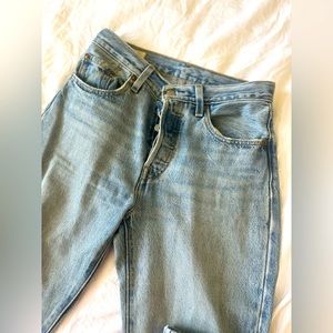 Levi 501 denim worn but still good condition. Has a slight Small stain as seen